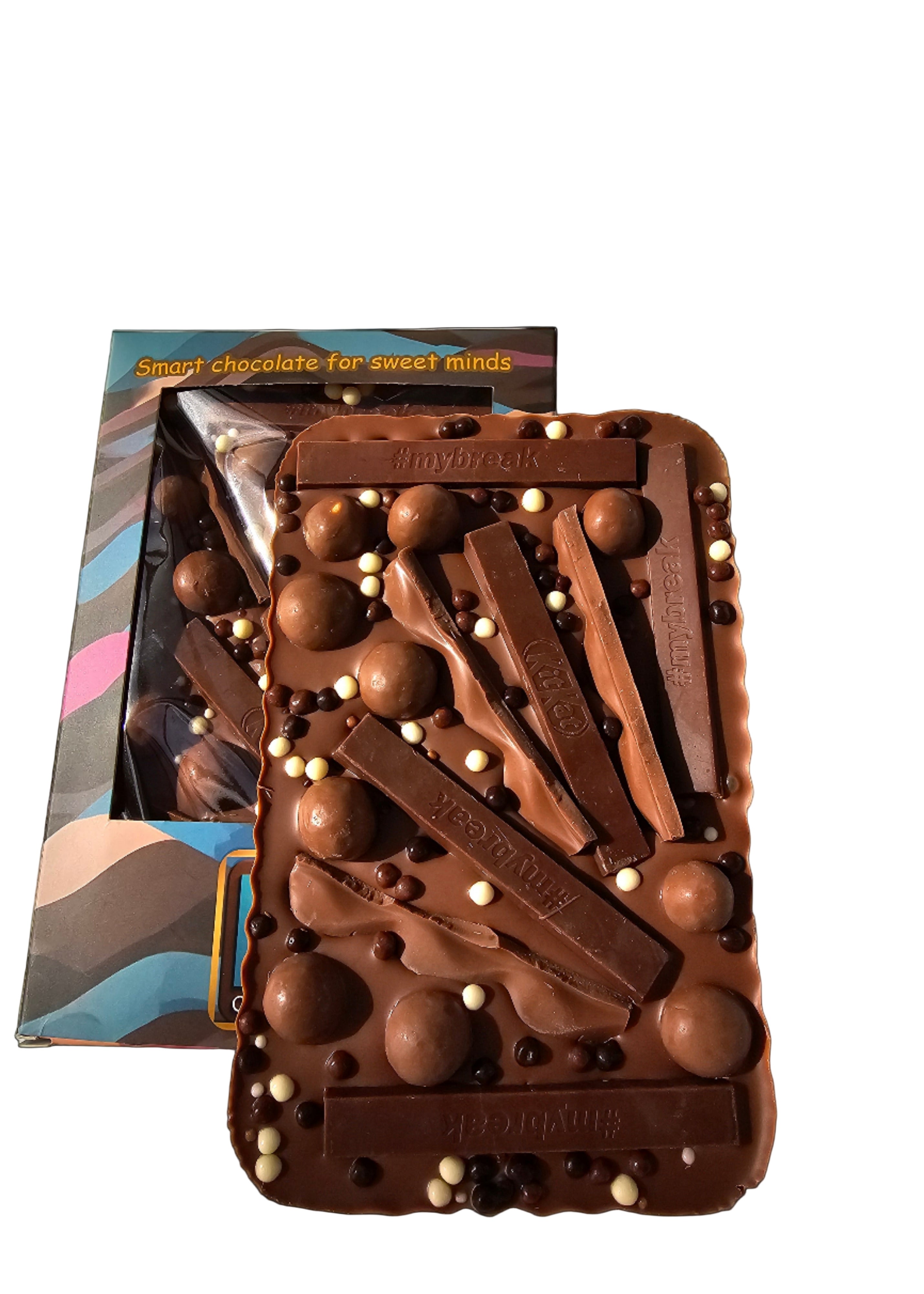 Chocolate bar with various shapes and a colorful packaging in the background